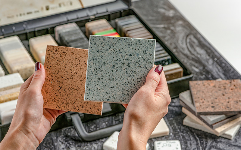 Person holding marble stone designs